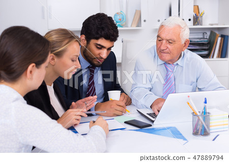 Employees are writing financial reports Employees are writing financial reports 47889794