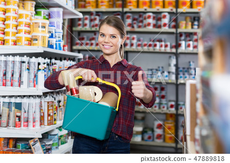 Woman is buying instruments for repair 47889818