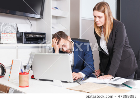 Frustrated female and male sales managers 47889885