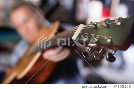 Image of modern acoustic guitar in music store. 47890169