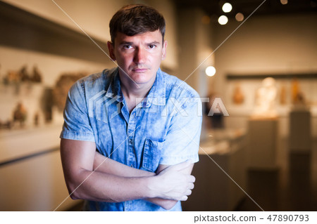 Man visiting exposition of historical museum 47890793