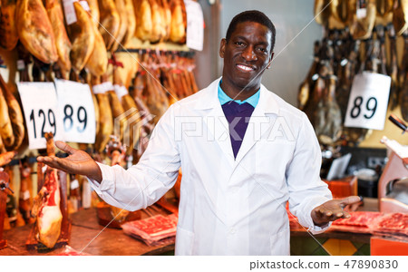 Seller working in meat shop 47890830