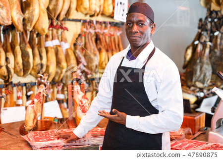 Seller offering jamon Seller offering jamon 47890875