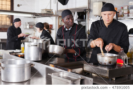 Professional male chef in kitchen of restaurant 47891005