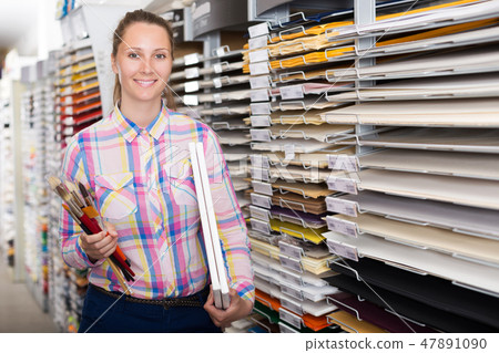 Customer picking multicolored paper for painting Customer picking multicolored paper for painting 47891090