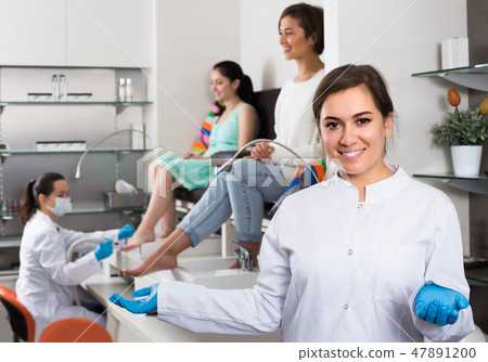 Portrait of professional nail master at working place inviting to salon 47891200