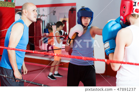 Boxer sparring on the ring 47891237