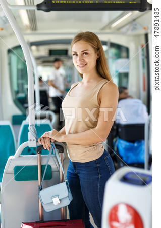 Woman traveling by subway train Woman traveling by subway train 47891485