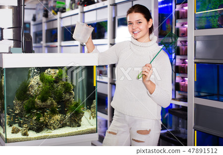 Woman preparing to catch a fish Woman preparing to catch a fish 47891512