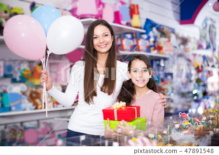 female and girl with gifts and balloons 47891548