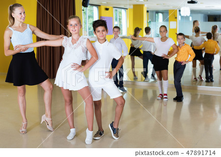 Group of children dancing tango in dance studio Group of children dancing tango in dance studio 47891714