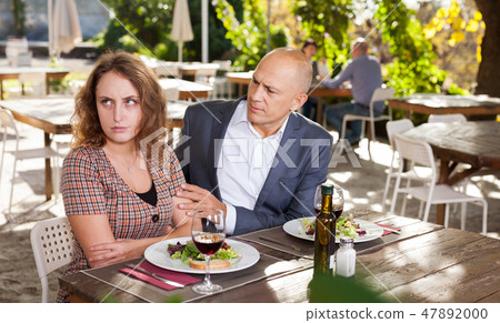 Family quarrel during lunch in an open-air restaurant Family quarrel during lunch in an open-air restaurant 47892000