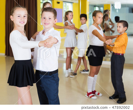 Children enjoying of partner dance Children enjoying of partner dance 47892002