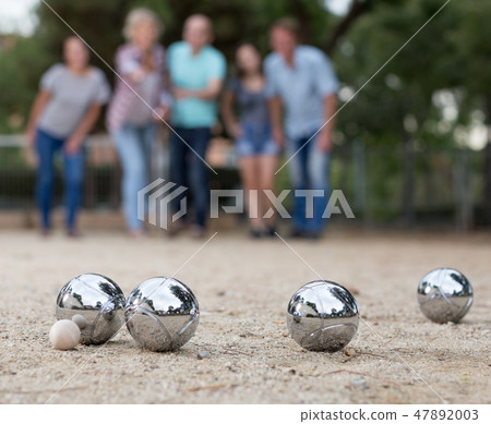 Image of people playing petanque on sand Image of people playing petanque on sand 47892003