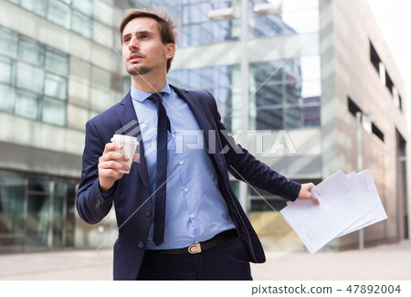 man with documents hurrying to meeting man with documents hurrying to meeting 47892004