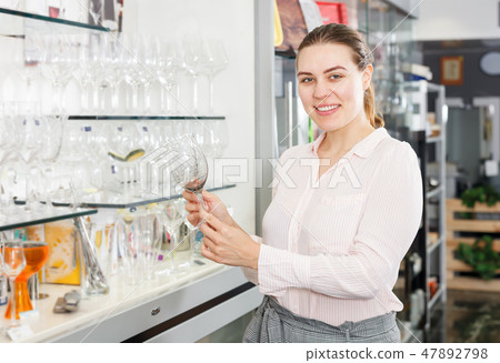 Glad woman consumer with wineglass 47892798