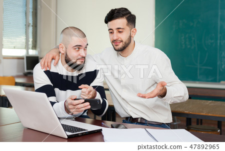University students using mobile phone University students using mobile phone 47892965