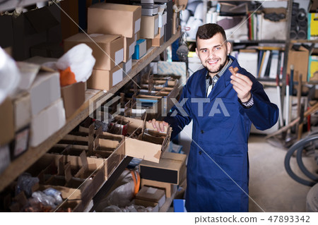 worker checking small details for sanitary engineering in workshop 47893342