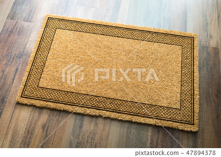 Blank Welcome Mat On Wood Floor Background Blank Welcome Mat On Wood Floor Background 47894378