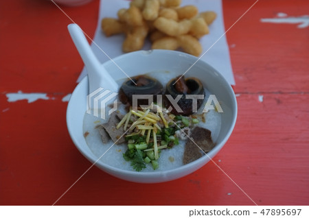 Rice soup minced pork and entrails  47895697
