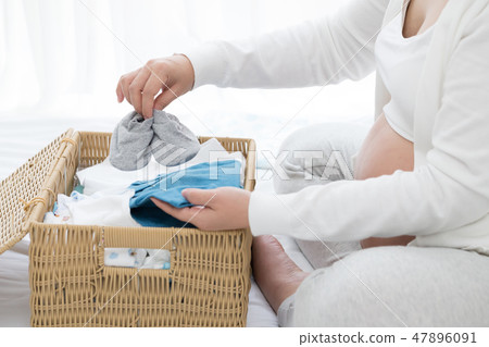 pregnant woman preparing and planning baby  47896091