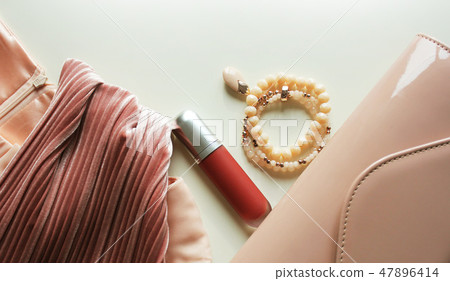 Woman colorful fashion clothes and accessory set on white background. Flat lay, top view. 47896414