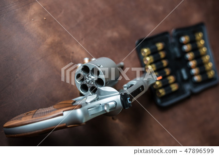 .44 magnum jacket soft point bullet on leather 47896599