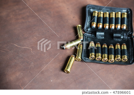 .44 magnum jacket soft point bullet on leather 47896601