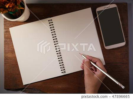 hands writing in notebook by pencil. hands writing in notebook by pencil. 47896665