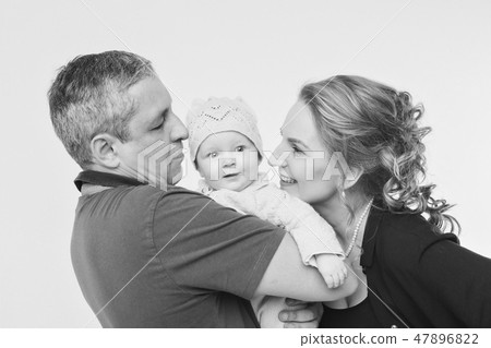 baby on the hands of parents on a white background. baby on the hands of parents on a white background. 47896822