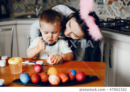 Mother with little son in a kitchen 47902382