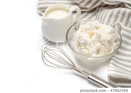 Traditional Mascarpone cheese and cream or milk isolated Traditional Mascarpone cheese and cream or milk isolated 47902569