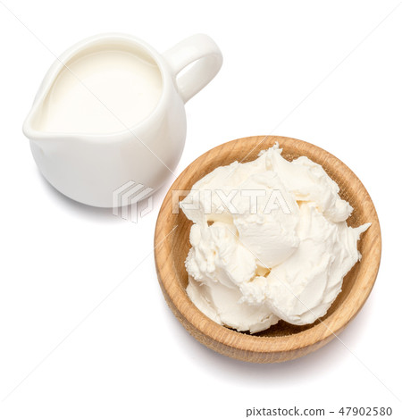 Traditional Mascarpone cheese and cream or milk isolated with clipping path 47902580
