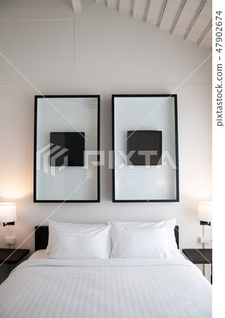 Asian contemporary hotel room with bed, pillows Asian contemporary hotel room with bed, pillows 47902674