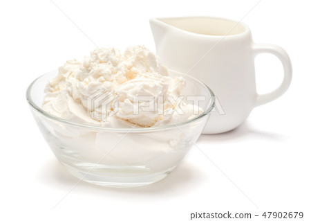 Traditional Mascarpone cheese and cream or milk isolated with clipping path 47902679
