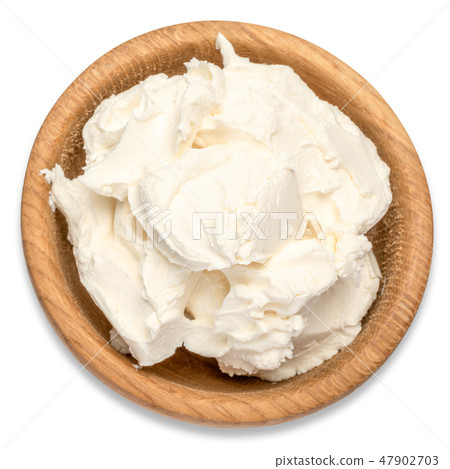 Traditional Mascarpone cheese in wooden bowl isolated with clipping path 47902703