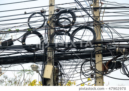 Messily Electric and Signal Wire on the Post 47902978