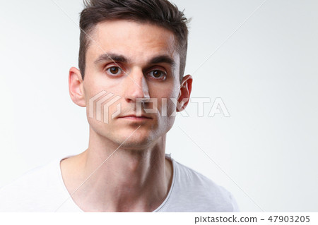 Fitness man portrait cute in a white tank Fitness man portrait cute in a white tank 47903205