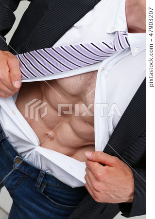 man in tie rip clothes off torso showing abs 47903207