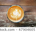 Cup of coffee on the table with Rosetta latte art. 47904605