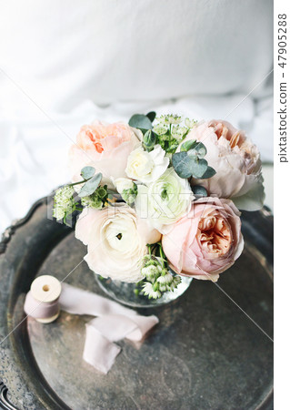 Cozy bedroom still life scene. Wedding, birthday bouquet of pink English roses, Ranunculus and Cozy bedroom still life scene. Wedding, birthday bouquet of pink English roses, Ranunculus and 47905288