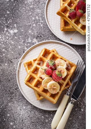 Waffles with strawberries and banana Waffles with strawberries and banana 47905732