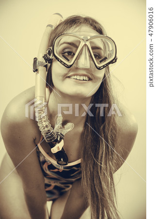 Woman with snorkeling mask having fun 47906016