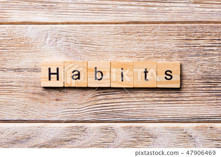 HABITS word written on wood block.  47906469