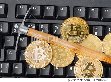 Computer and pickaxe on bitcoins Computer and pickaxe on bitcoins 47906829