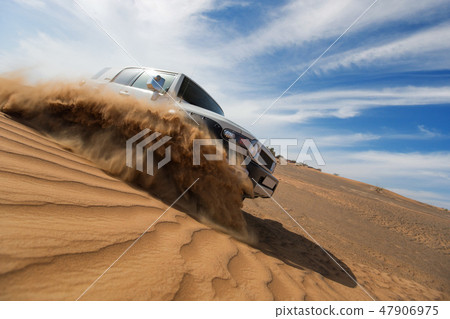 Four wheel drive car the desert in the United Arab Emirates. 47906975