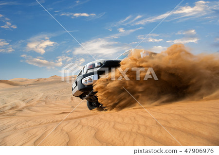 Four wheel drive car the desert in the United Arab Emirates. 47906976