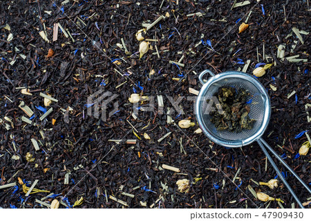 Background of dry tea leaves and flowers. 47909430
