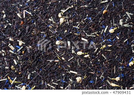Background of dry tea leaves and flowers. Background of dry tea leaves and flowers. 47909431