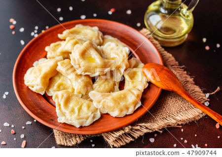 The boiled made dumplings with a stuffing  47909744